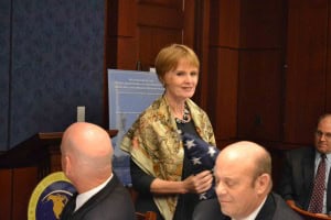 RADM (ret) Kate Paige receives the first flag flown by the U.S.S Curtis Wilbur (DDG 54). 