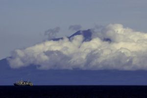Clouds partly cover the volcano Tyatya on the Southern Kurile Island of Kunashir